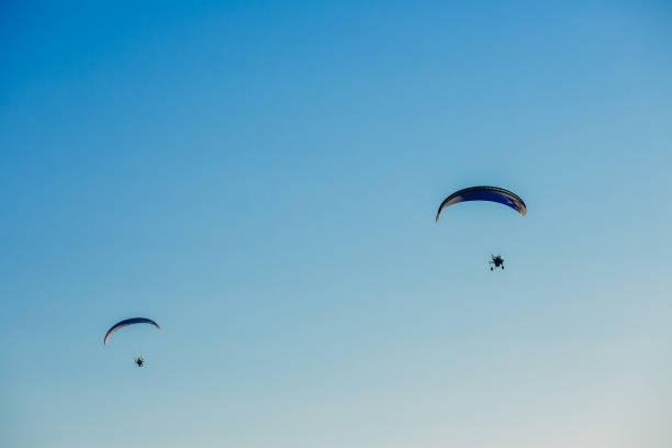 istock Paragliding flight with blue sky and some clouds 1081688174