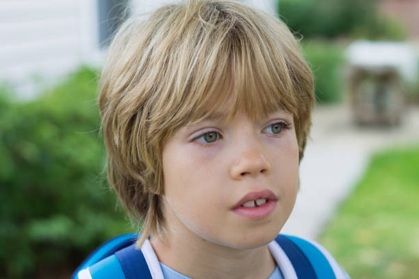 istock Portrait of a boy with blurred background 1081688538