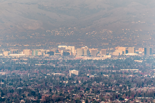 Aerial view of downtown San Jose on a sunny afternoon; Silicon Valley, south San Francisco bay area, California; pollution and smog visible in the air