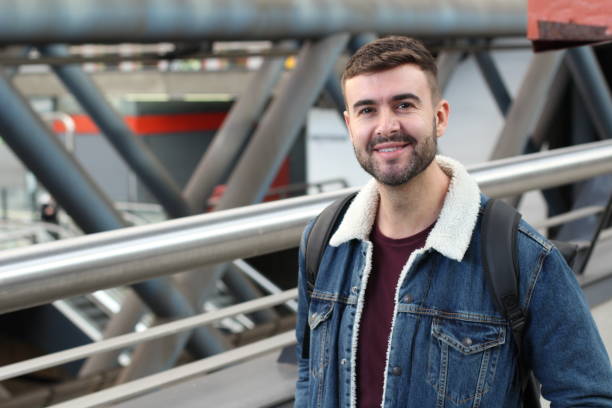 istock Man smiling in underground station 1081693754