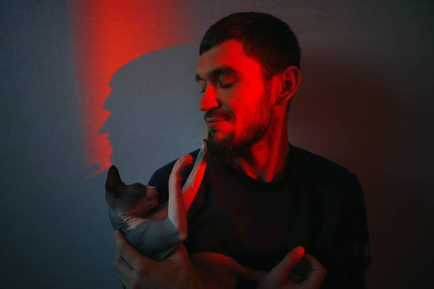 istock Young brunet man relaxing with his cat at home. 1081705548