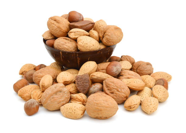 istock wooden bowl  with almonds, walnuts and hazelnuts. 1081709018