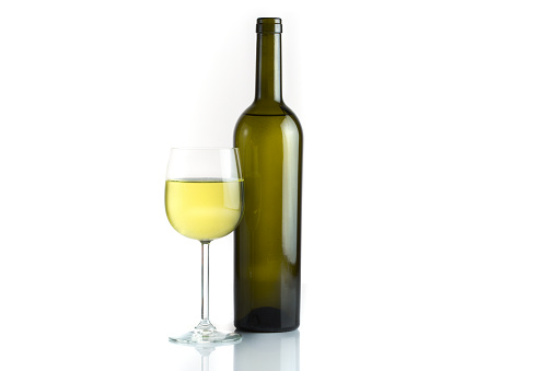 Bottles of and glasses white wine isolated on white background