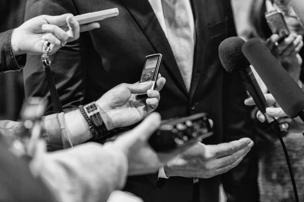 istock Cropped Hands Of Journalists Interviewing Businessman 1081734904