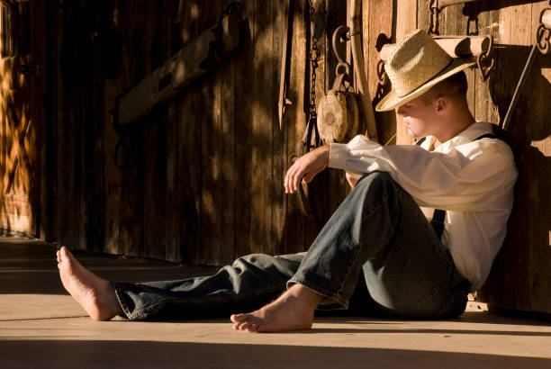 istock Cowboy Farmer Man Sitting on Deck 108174019