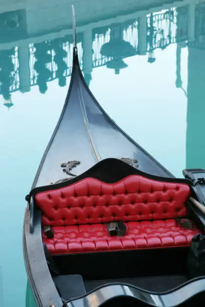 Close-up of luxurious Gondola with beautiful details and reflections in the water.