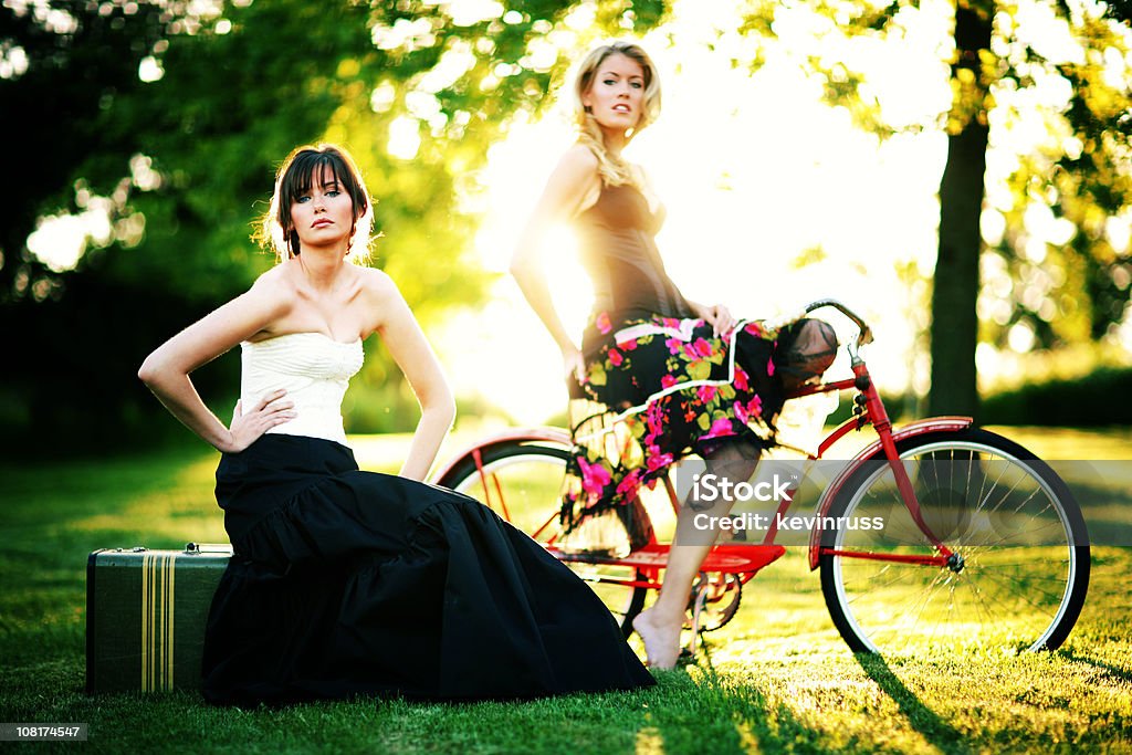 Two Females with Old Suitcase and Red Bike  Adult Stock Photo