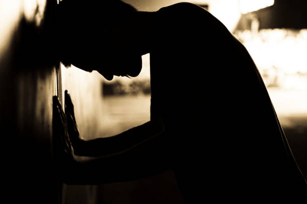 istock Silhouette of Man Banging Head on Wall 108174718