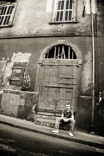 Istockalypse Marseille, Young man sitting on grunge street begging. (thanks Peter !)