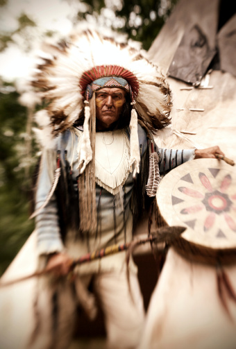 American Indian Chief in warrior pose. Taken at Austin SxSWLypse. This image was lucky enough to win Best of Show for the event. Image shot with Lens Baby.