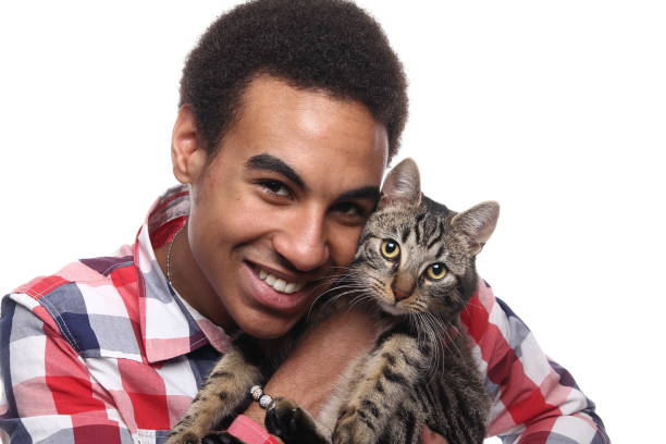 istock Beautiful young man with a cat 1081749822
