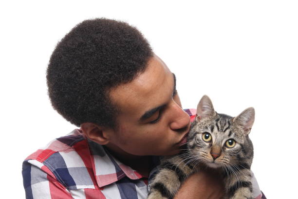 istock Beautiful young man with a cat 1081749826