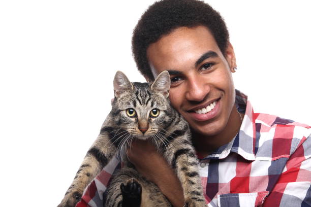 istock Beautiful young man with a cat 1081749834
