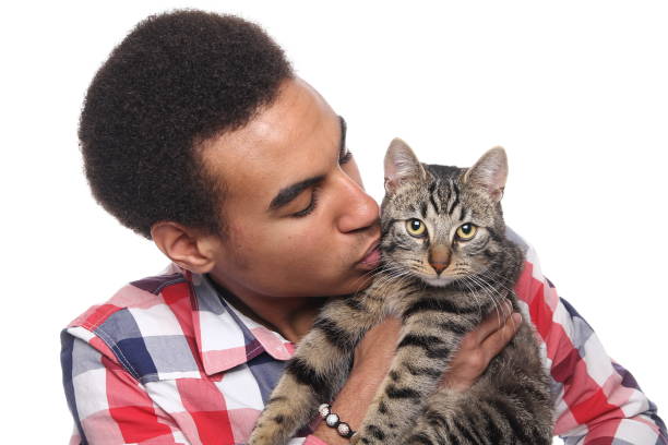 istock Beautiful young man with a cat 1081749836