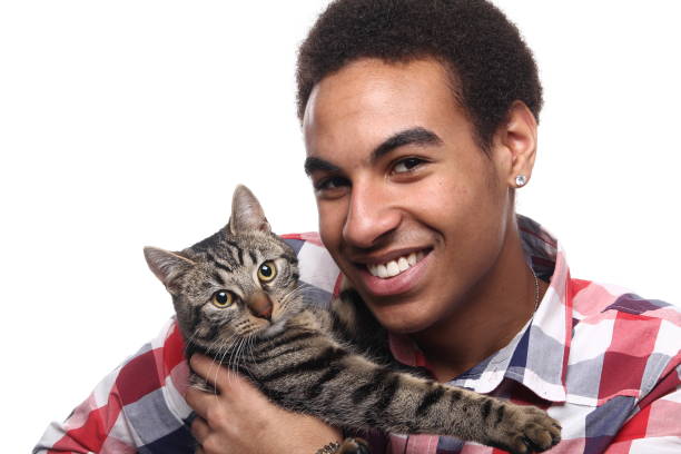 istock Beautiful young man with a cat 1081749840