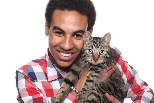istock Beautiful young man with a cat 1081749852