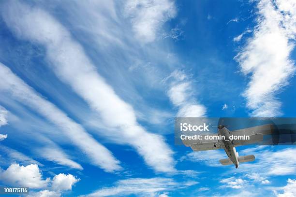 Small Airplane Biplane On The Blue Cloudy Sky Frog Perspective Stock Photo - Download Image Now