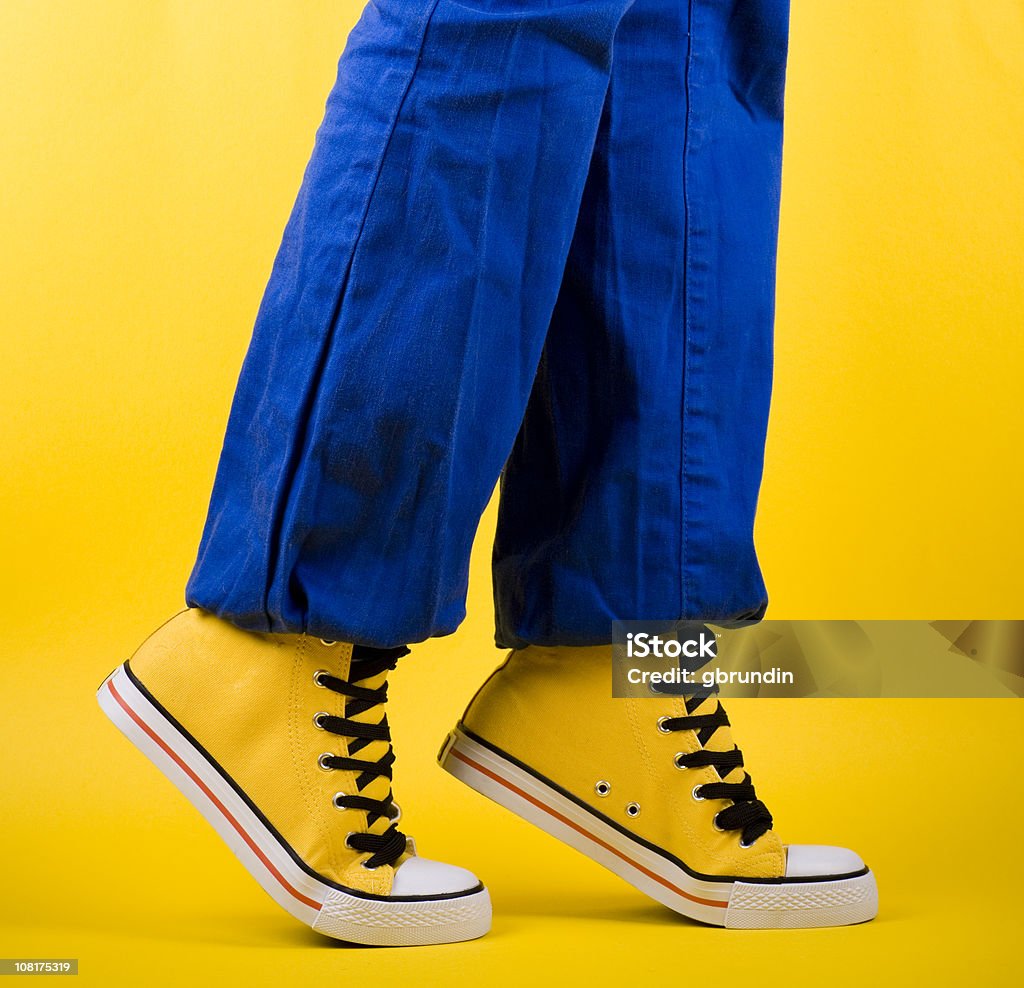 Person in Yellow Shoes Standing on Toes  Balance Stock Photo