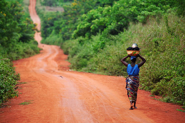 african woman on the road stock photo