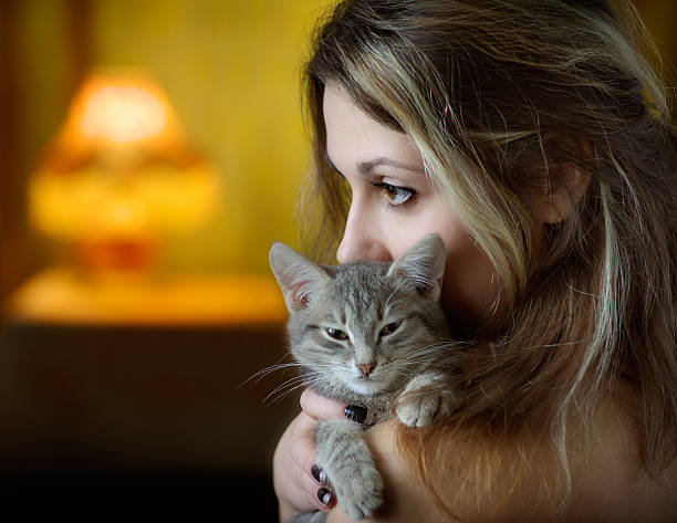 istock Woman Holding and Cuddling Kitten 108175569