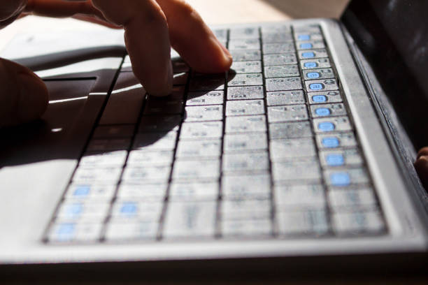 istock Fingers on the laptop keyboard 1081758082