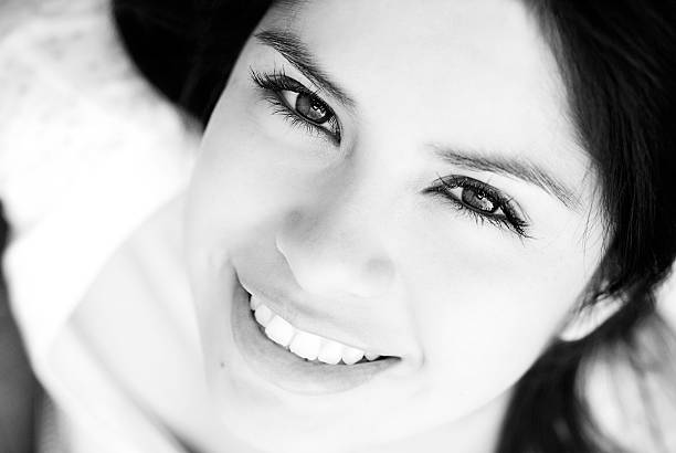 happy little girl portraiton on black background