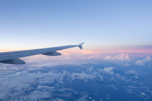 istock Clouds and sky as seen through window of an aircraft 1081759926