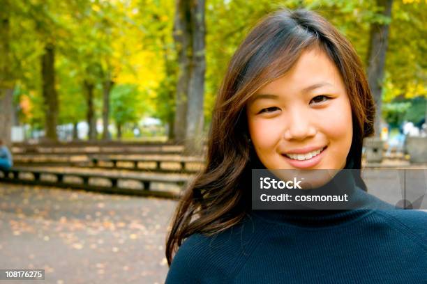 Asian Young Woman Outside In Park Stock Photo - Download Image Now - Confidence, Sunlight, 20-24 Years