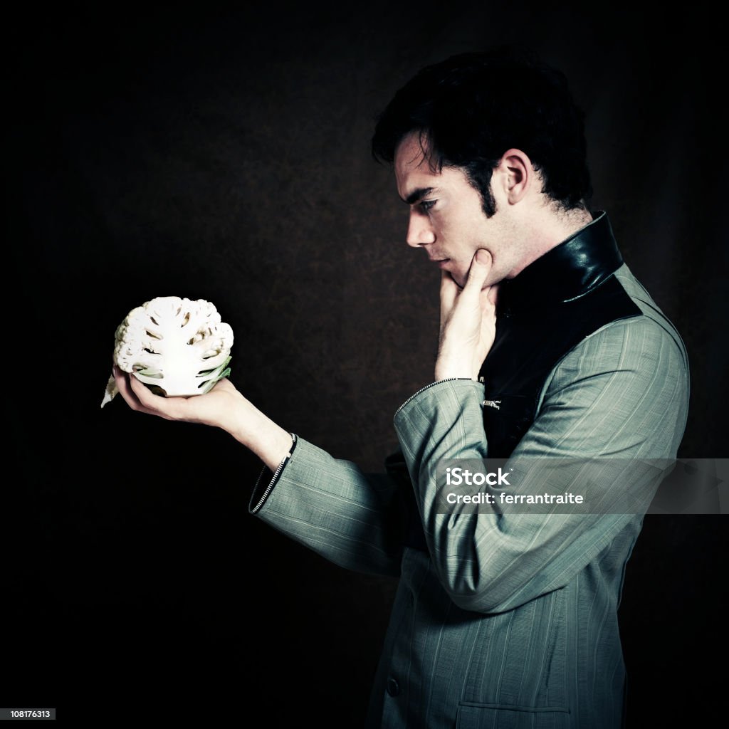 The Vegetarian Modern men with cauliflower. "To be or not to be... vegeterian" William Shakespeare Stock Photo