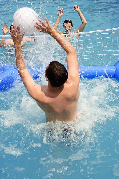 istock Group of Young People Playing Volleyball in Pool 108176398