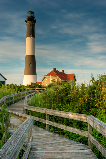 The tower of Highland Lighthouse, also known as Cape Cod Light ( 1857) against a springtime blue sky in Truro, Massachusetts