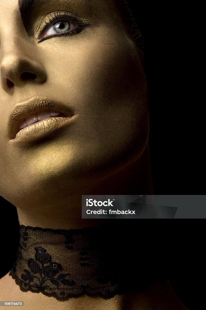 Young Woman Wearing Gold Face Paint And Lace Stock Photo - Download Image  Now - Gold Colored, Fashion, Human Lips - iStock