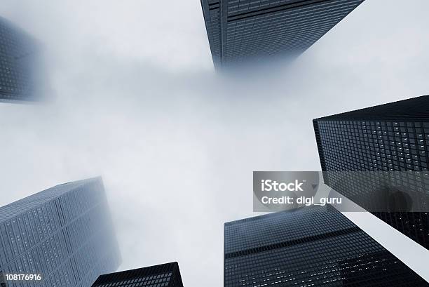 Looking Up At Skyscraper Office Buildings With Fog Stock Photo - Download Image Now - Fog, City, Building Exterior