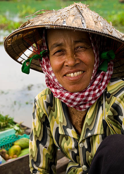 istock Cambodian Woman in Boat 108176960