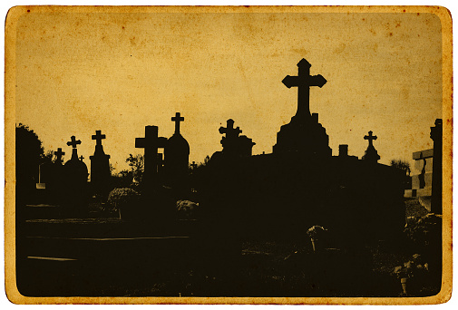 A sunny day in an old cemetery with ruined ornamental tombs - Lafayette Cemetery No. 2 in New Orleans.