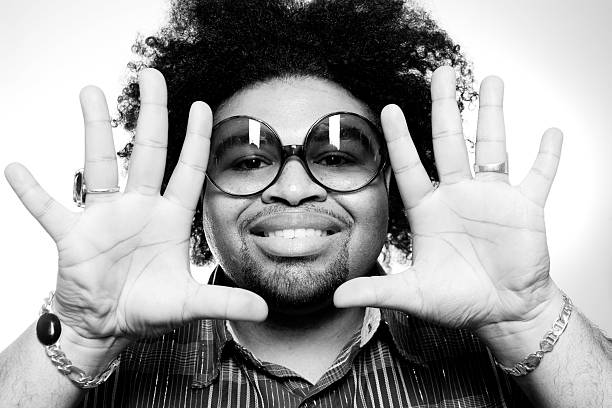 Man Wearing Sunglasses and Framing Face with Hands