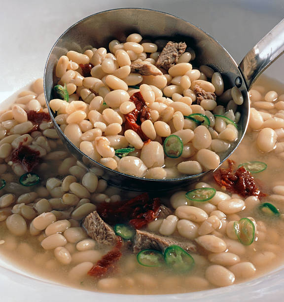 Bean Soup Ladeled into Bowl stock photo