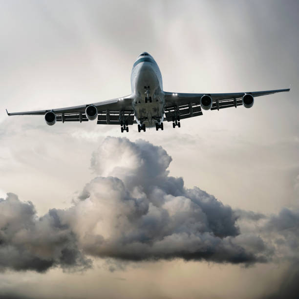 istock jumbo jet airplane landing in storm 108177154
