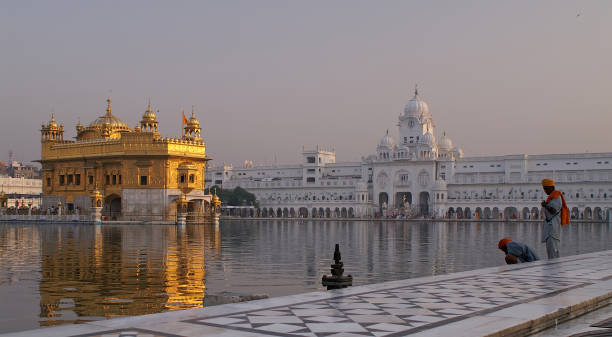 istock People Standing at Pond in Golden Temple Amritsar 108177165