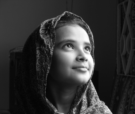 Portrait of a smiling Muslim teenager looking at the camera