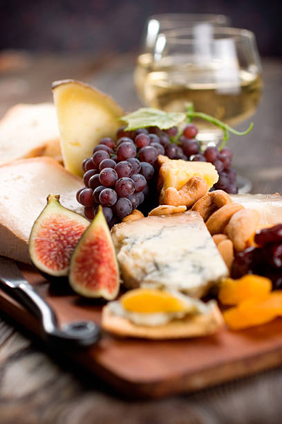 Cheese and Wine  plate fig blue cheese cheese stock pictures, royalty-free photos & images