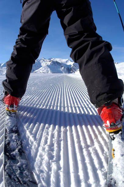 istock Person's Legs in Skis Up Hill Looking at Mountain 108177860