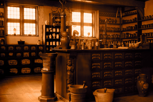 19th Century log cabin interior. Old times farmhouse - interior of an old country house with fireplace and kitchen