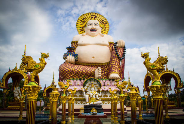 Statue of a fat Chinese priest Statue of a fat Chinese priest in Buddhist temple at Koh Samui,Thailand. hotei the god of happiness stock pictures, royalty-free photos & images