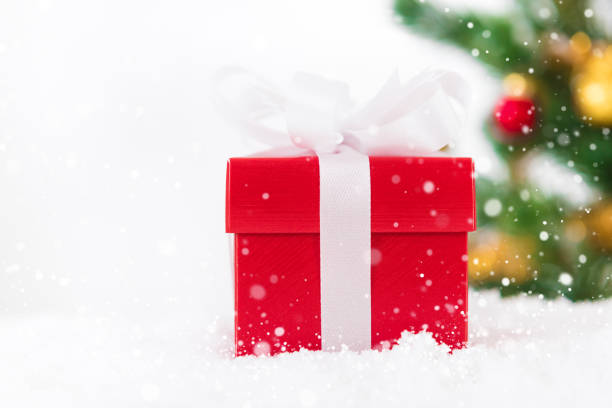 istock Red gift box in the snow 1081783446