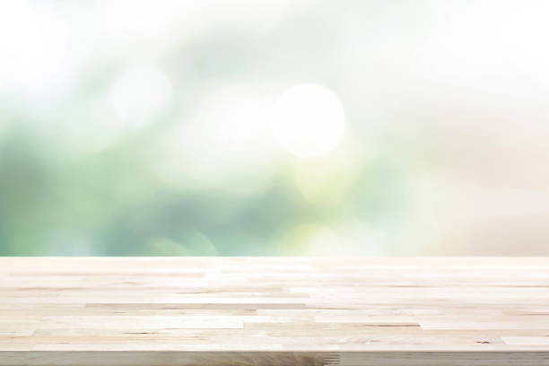 istock Wood table top on shiny light green bokeh background 1081783460