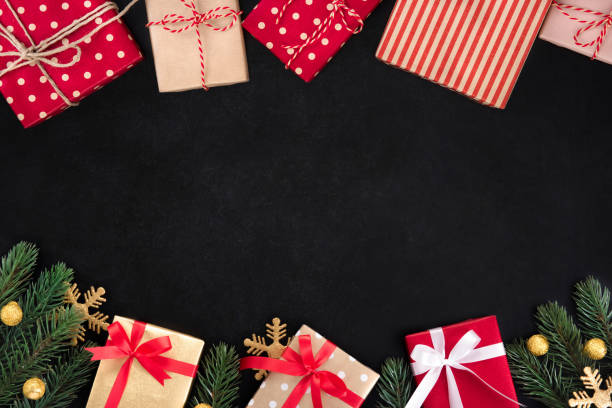 istock Gift boxes and Christmas ornaments, border design, on blackboard 1081783580