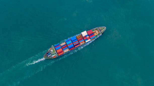 istock Aerial view container ship carrying container for import and export, business logistic and freight transportation by ship in open sea. 1081783842