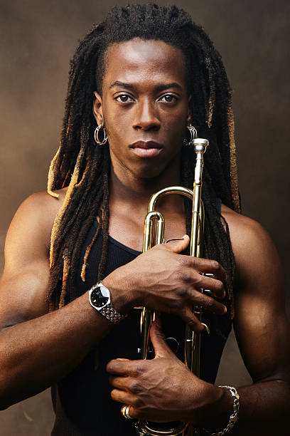 istock Young Man Holding Trumpet 108178397