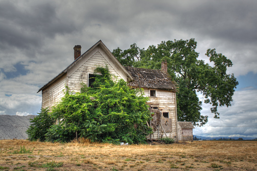 The house made of red brick. An old ruined house.